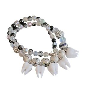 Elegant Beaded Necklace with Tooth Charms